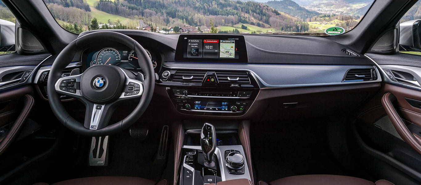 Side shot of BMW 5 Series – sporty executive sedan with muscular lines