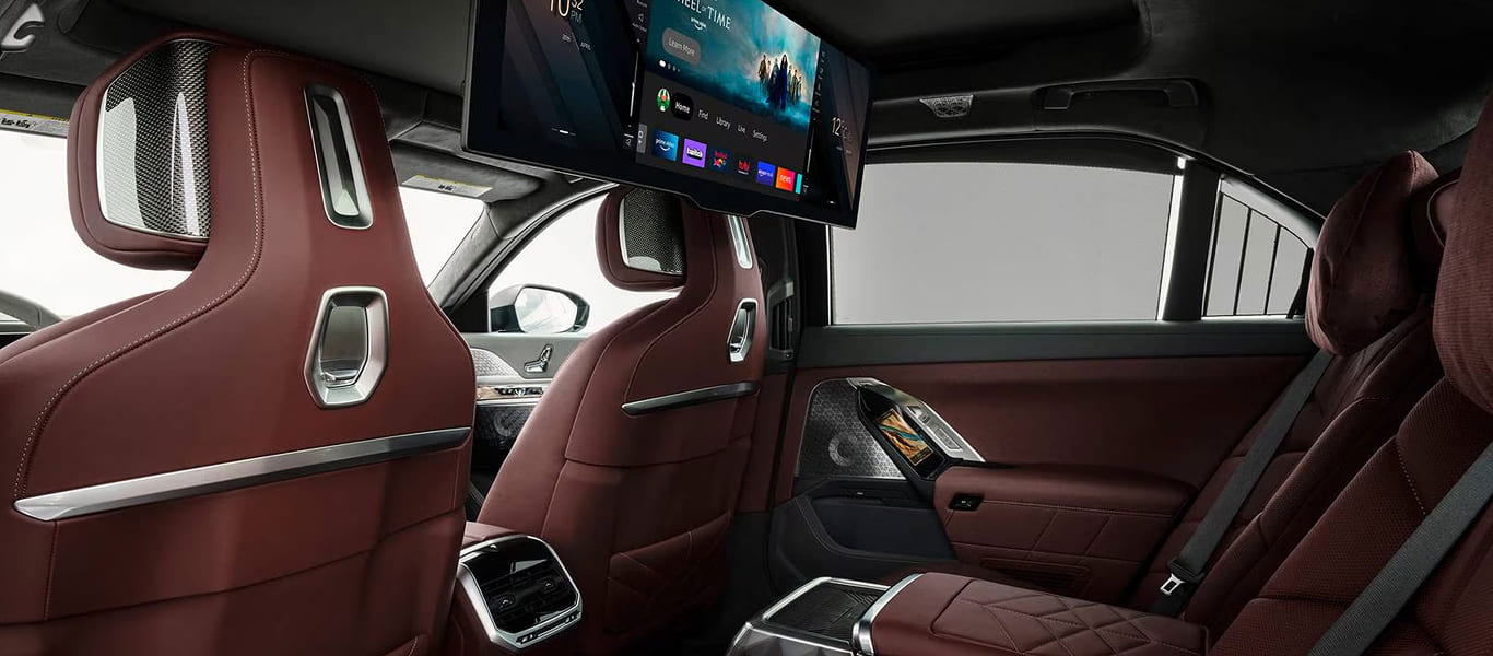Rear angle featuring iconic L-shaped taillights and strong luxury presence.