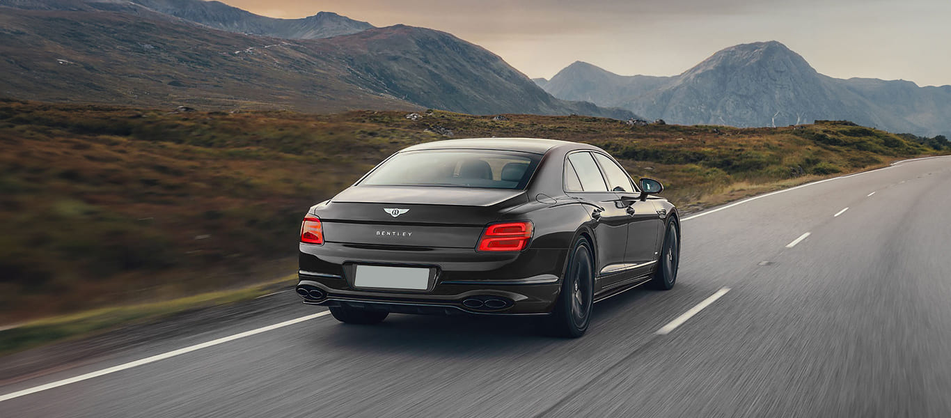 Front quarter perspective with signature matrix grille and bold luxury lines.