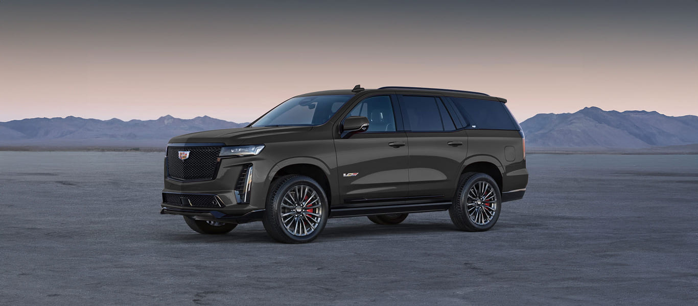 Front angle of Cadillac Escalade – imposing luxury SUV with bold grille