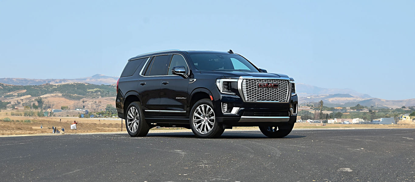 Front view showcasing bold grille and elevated ride height.