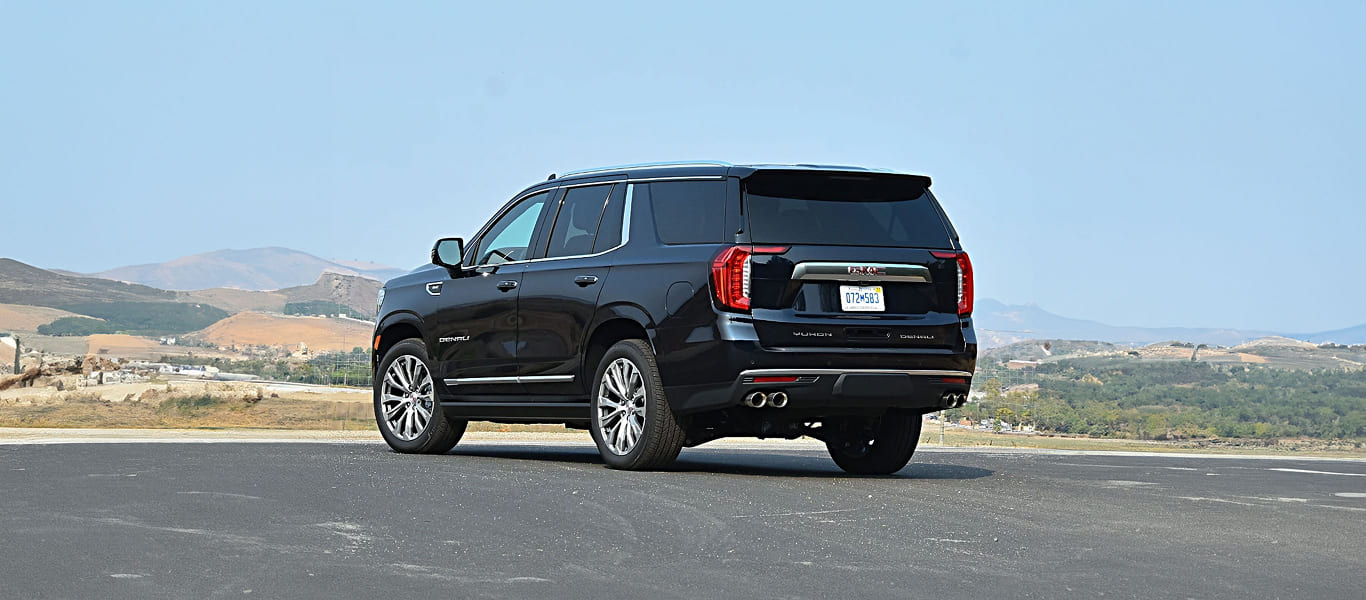 Side view with tinted windows and powerful body lines.