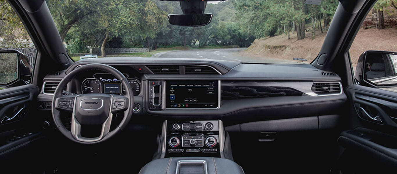 Rear view of the Yukon highlighting full-size SUV form and premium finish.
