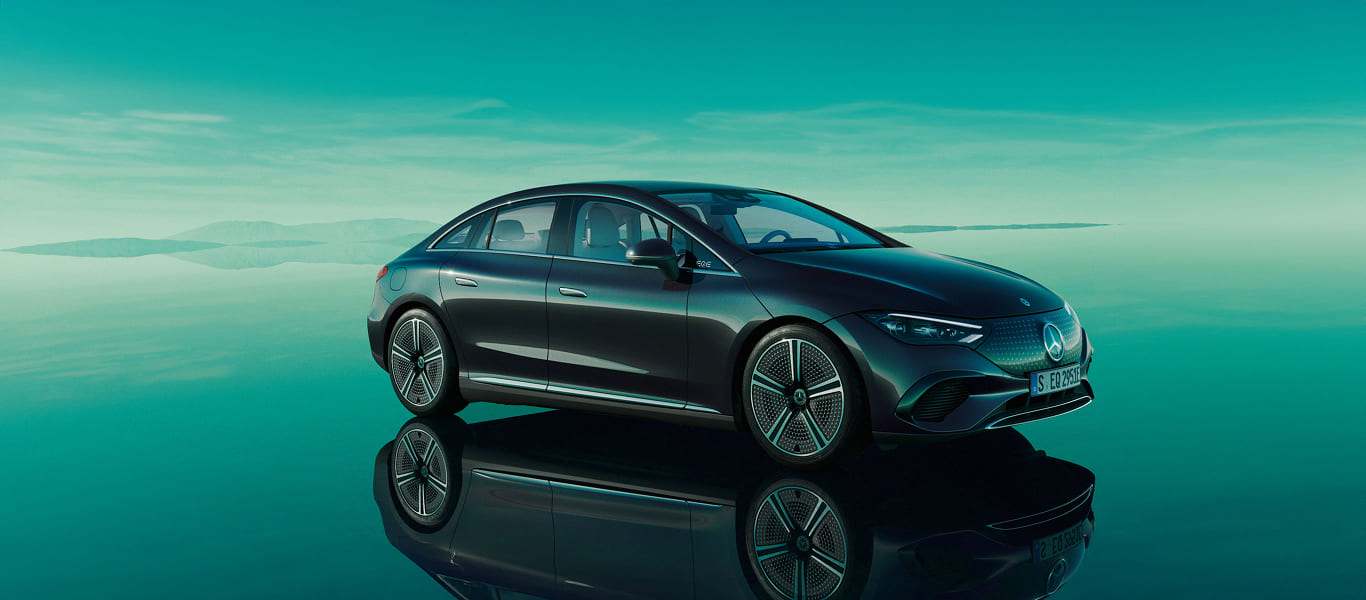 Front and side angle of the EQE highlighting its electric luxury and fluid silhouette.