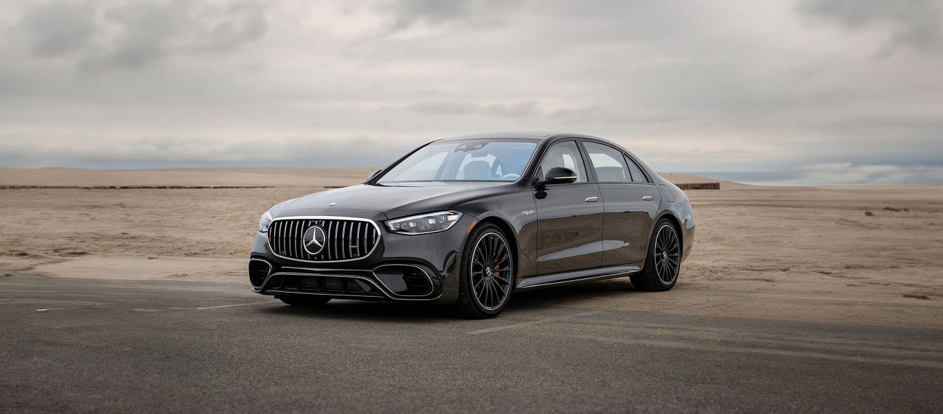 Interior showcasing refined materials, ambient lighting, and first-class rear seating.