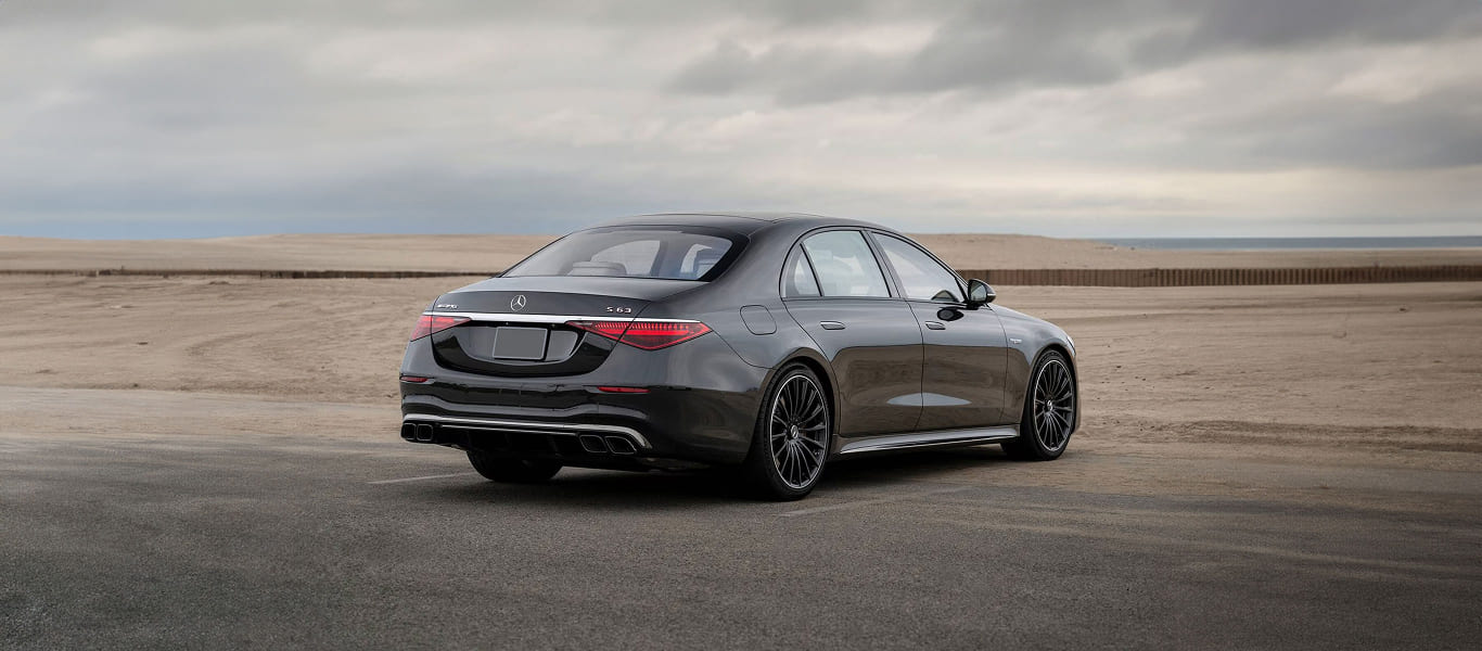 Front angle with the signature grille and high-tech lighting design.