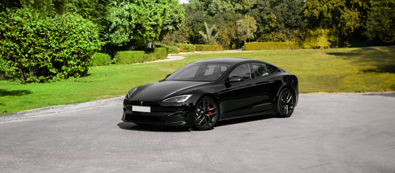 Head-on view of Tesla Model S – bold presence and aerodynamic front