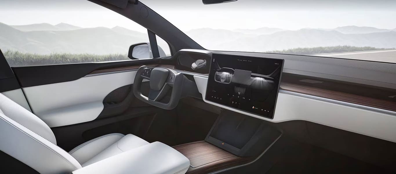 Side view of Tesla Model X – aerodynamic electric SUV with bold form